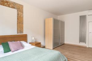 Posteľ alebo postele v izbe v ubytovaní Nice apartment near Piazza Kalsa by Wonderful Italy