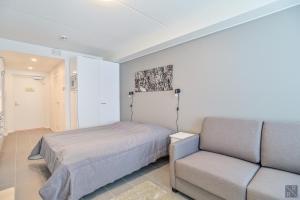 Postel nebo postele na pokoji v ubytování Holiday In Lapland - Levi Postintie 3B 322