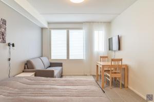 Postel nebo postele na pokoji v ubytování Holiday In Lapland - Levi Postintie 3B 322