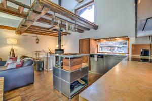 a large kitchen with a couch and a table at Bodmen 305 in Blitzingen