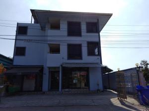 a white building with a store in front of it at SRS3 STUDIO APARTMENT in Ban Bang Kha