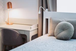 מיטה או מיטות בחדר ב-Neringarent Apartamentai