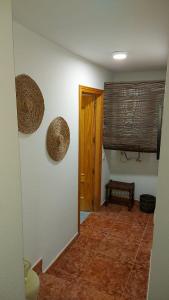 a hallway of a house with a door and a window at Casa Rural cueva cerros in Fuentidueña de Tajo