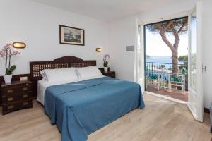 Posteľ alebo postele v izbe v ubytovaní Hotel Antares
