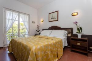 Ein Bett oder Betten in einem Zimmer der Unterkunft Hotel Antares