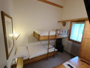 Postelja oz. postelje v sobi nastanitve Hôtel Cristal - Swiss Riders Lodge Grimentz