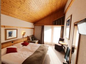 Postelja oz. postelje v sobi nastanitve Hôtel Cristal - Swiss Riders Lodge Grimentz