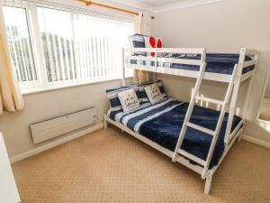 Ένα ή περισσότερα κρεβάτια σε δωμάτιο στο Windy Ridge