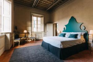 Posteľ alebo postele v izbe v ubytovaní Palazzo Feroci - Residenza d'epoca