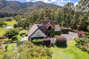 an aerial view of a house in a garden at The Castle at Bonville in Bonville
