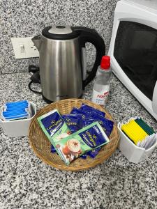 a basket of food on a counter next to a toaster at Departamento en Centro de Salta in Salta