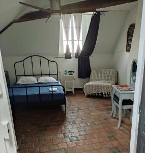 En eller flere senge i et værelse på Au pied du château