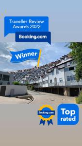a picture of an apartment complex with the words top rated at Luxus Appartement Brühlervorstadt Erfurt in Erfurt