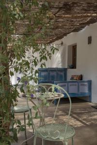 a room with a table and two chairs and a table at Muxima - Aljezur in Aljezur +53 photos