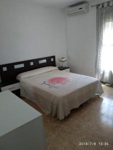 a bedroom with a bed in a white room at MOJACAR PLAYA in Mojácar