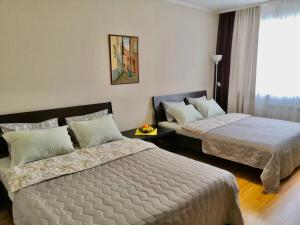 Кровать или кровати в номере Apartments at metro Krasniy prospekt - Pokryshkina