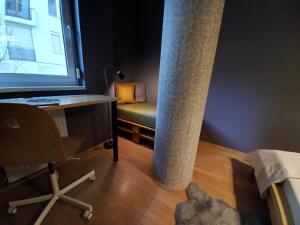a room with a desk and a chair and a window at InnerCity Apartments in Budapest