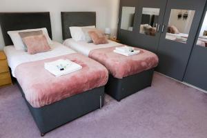 Säng eller sängar i ett rum på Blue Apartment in Peterborough
