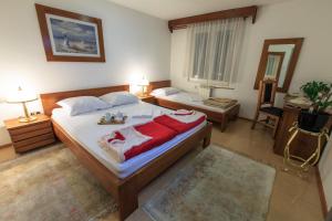 Ένα ή περισσότερα κρεβάτια σε δωμάτιο στο Vila Castello
