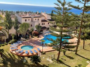 an aerial view of a resort with a swimming pool at Apartamentos El Toro in Marbella