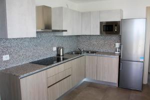 Kuchyňa alebo kuchynka v ubytovaní Nashira Apartments