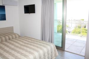 Posteľ alebo postele v izbe v ubytovaní Nashira Apartments