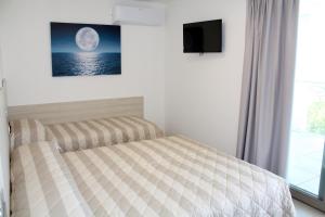 Posteľ alebo postele v izbe v ubytovaní Nashira Apartments
