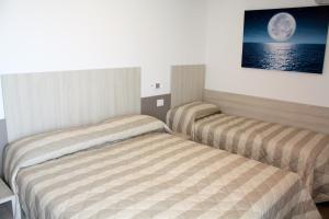Posteľ alebo postele v izbe v ubytovaní Nashira Apartments
