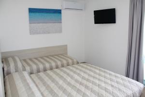 Posteľ alebo postele v izbe v ubytovaní Nashira Apartments
