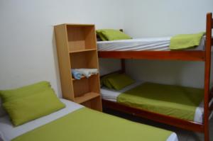 Postel nebo postele na pokoji v ubytování Hostal El Naufrago 1