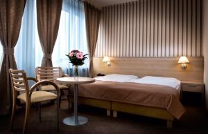 Postel nebo postele na pokoji v ubytování Hotel Tatra
