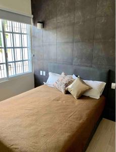 Een bed of bedden in een kamer bij Paradise Huatulco Condo TANGOLUNDA BEACH