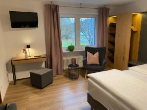 TV a/nebo společenská místnost v ubytování Hotel Ostermann