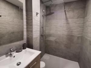 a bathroom with a sink and a toilet and a shower at Canyelles BBQ Apartment in Lloret de Mar +35 photos