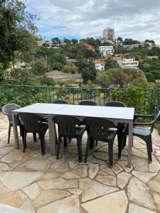 a table and chairs on a patio with a view at Canyelles BBQ Apartment in Lloret de Mar