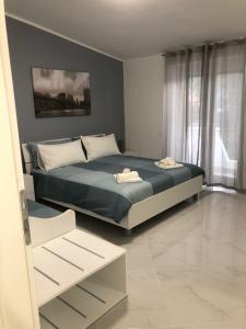 A bed or beds in a room at VILLA LUDO a ZAMBRONE TROPEA