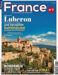 a magazine cover with a view of a city at Le Bonheur in Gordes