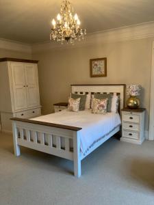 a bedroom with a bed and a dresser at Gallows Hill in Scarborough