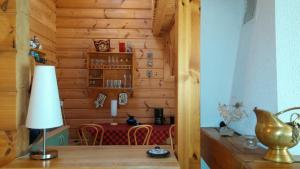 a room with a table and a lamp on a table at Vila Dovilas in Palanga