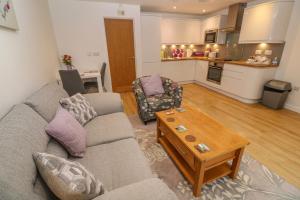 a living room with a couch and a coffee table at Pippas place in Penzance