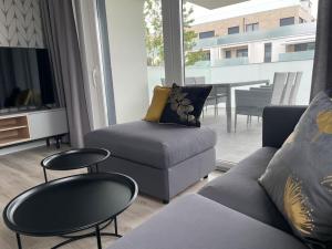 Posedenie v ubytovaní Całkowicie nowy Apartament przy plaży + 37 fotografií