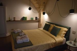 Postel nebo postele na pokoji v ubytování MATTEI LUXURY B&B
