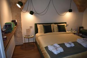 Postel nebo postele na pokoji v ubytování MATTEI LUXURY B&B