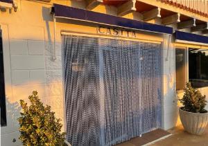 a closed gate in the front of a store at Habitaciones en casa rural particular La Casita in Ibi