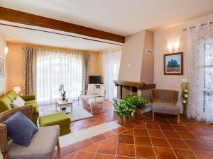 a living room filled with furniture and a fireplace at Villa Salvea with heated pool in Montižana