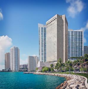 a city skyline with tall buildings and a body of water at InterContinental Miami, an IHG Hotel in Miami