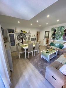 a living room with a couch and a table at Monte Gordo apartment in Monte Gordo