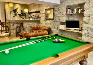 a billiard table in a living room with afits at Holzer II in Porto-Vecchio