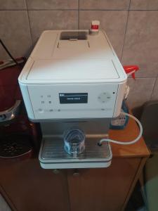 a espresso machine sitting on top of a table at Apartment Ploiesti in Ploieşti