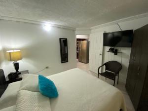 מיטה או מיטות בחדר ב-Posada Turistica el Swampito